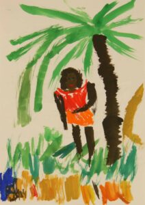 Mujer bajo una palmera